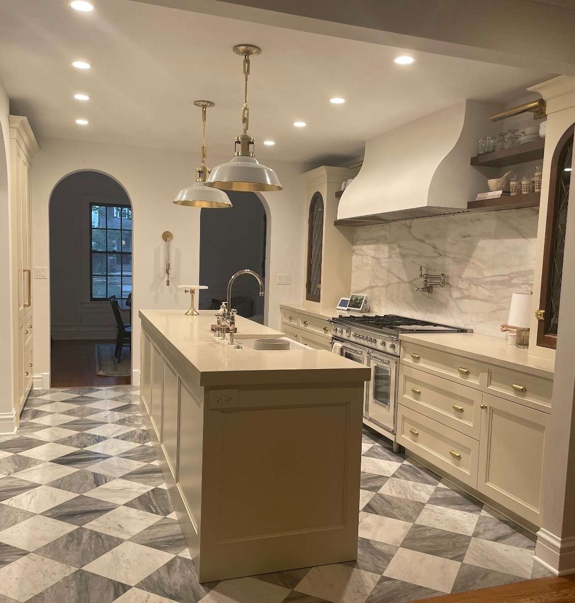 Elegant kitchen with marble counters and checkered floor