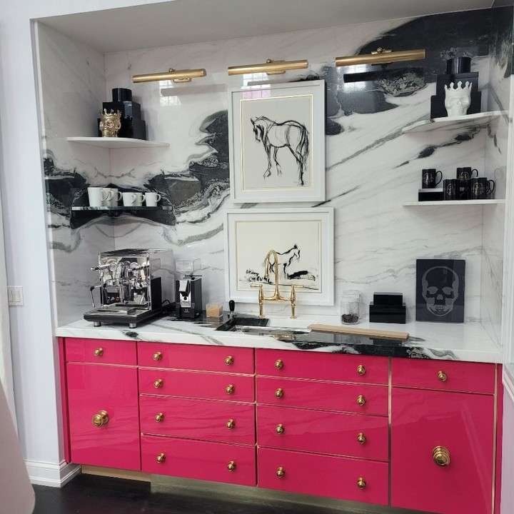 Luxurious kitchen with pink cabinetry and marble walls