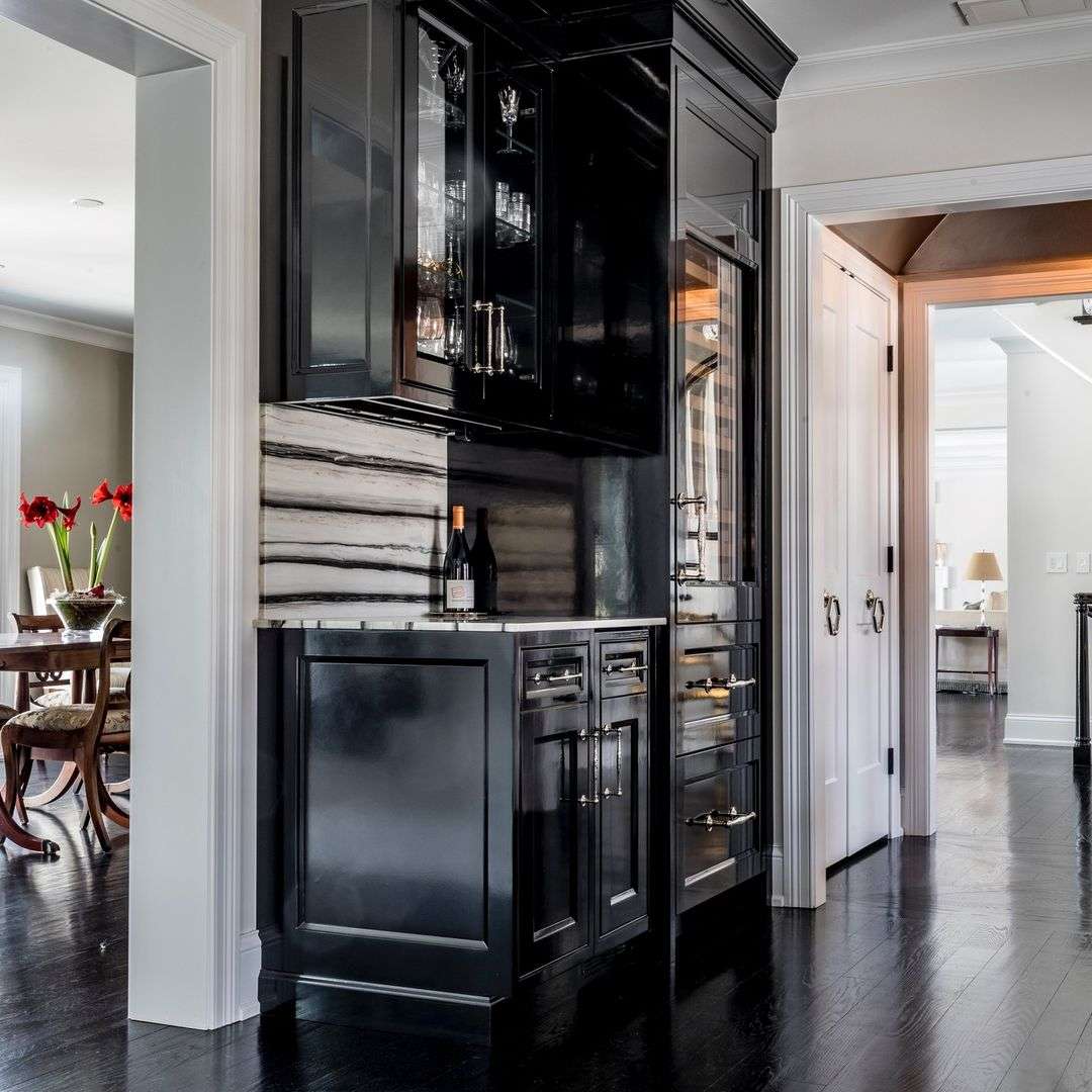 Elegant kitchen with black cabinets and marble countertop